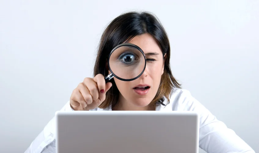 Woman focusing with magnifier