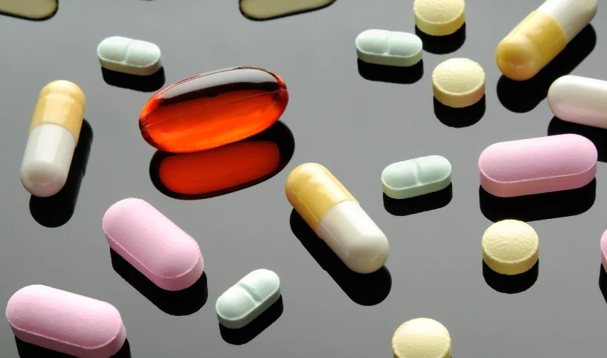 Capsules and Pills, Prescription, OTC, Recreational Drugs, Reflective Black Surface
