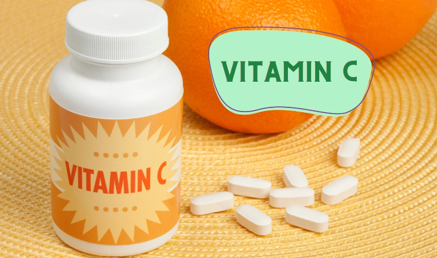 Vitamin C supplements on tables, Oranges in behind