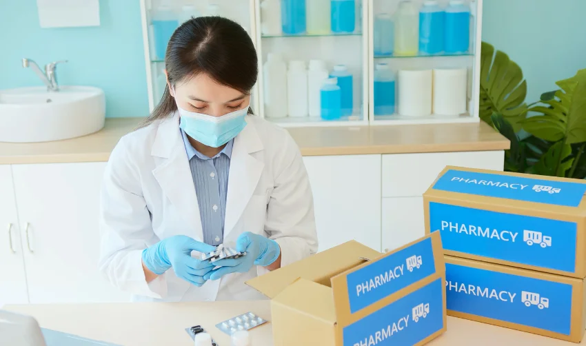 Asian Pharmacist Pack Medication