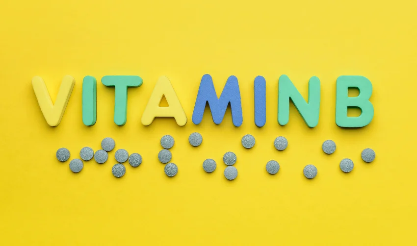 Text VITAMIN B with Pills on Color Background